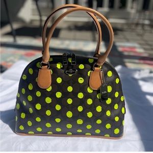 Coach dome bag with neon green polka dots